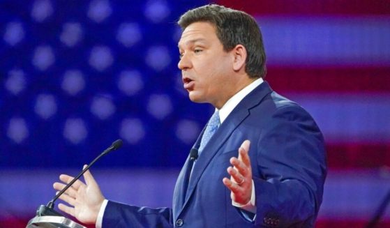 Florida Gov. Ron DeSantis, seen speaking at an event in February, said a Disney executive 'crossed the line' by pressuring against a controversial new bill restricting lessons about sexual orientation or gender identity to grades four and above, and only when age-appropriate.