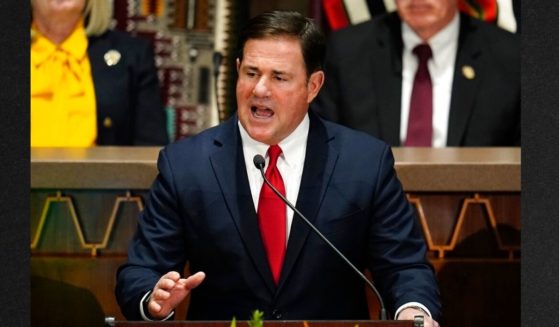 Arizona Republican Gov. Doug Ducey, seen in a file photo from January, signed bills Wednesday to limit abortion and restrict sports competitors to playing based on their biological gender.