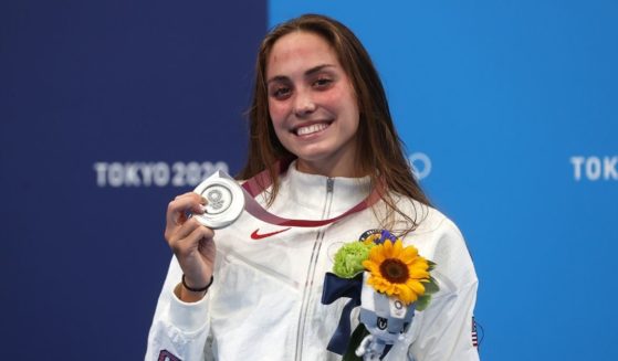 Emma Weyant poses with the silver medal for the women's 400-meter individual medley during the Tokyo Olympic Games at the Tokyo Aquatics Centre on July 25, 2021, in Tokyo.