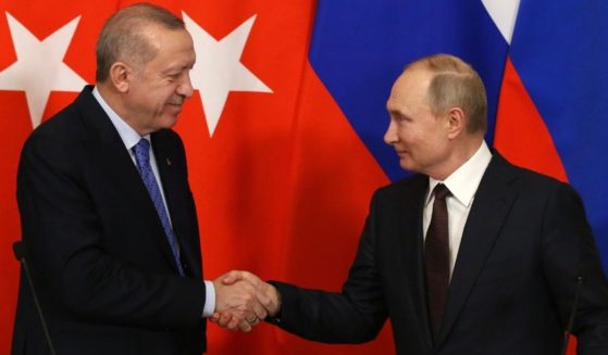 Russian President Vladimir Putin, right, and Turkish President Recep Tayyip Erdogan shake hands during their talks at the Kremlin in Moscow on March 5, 2020.