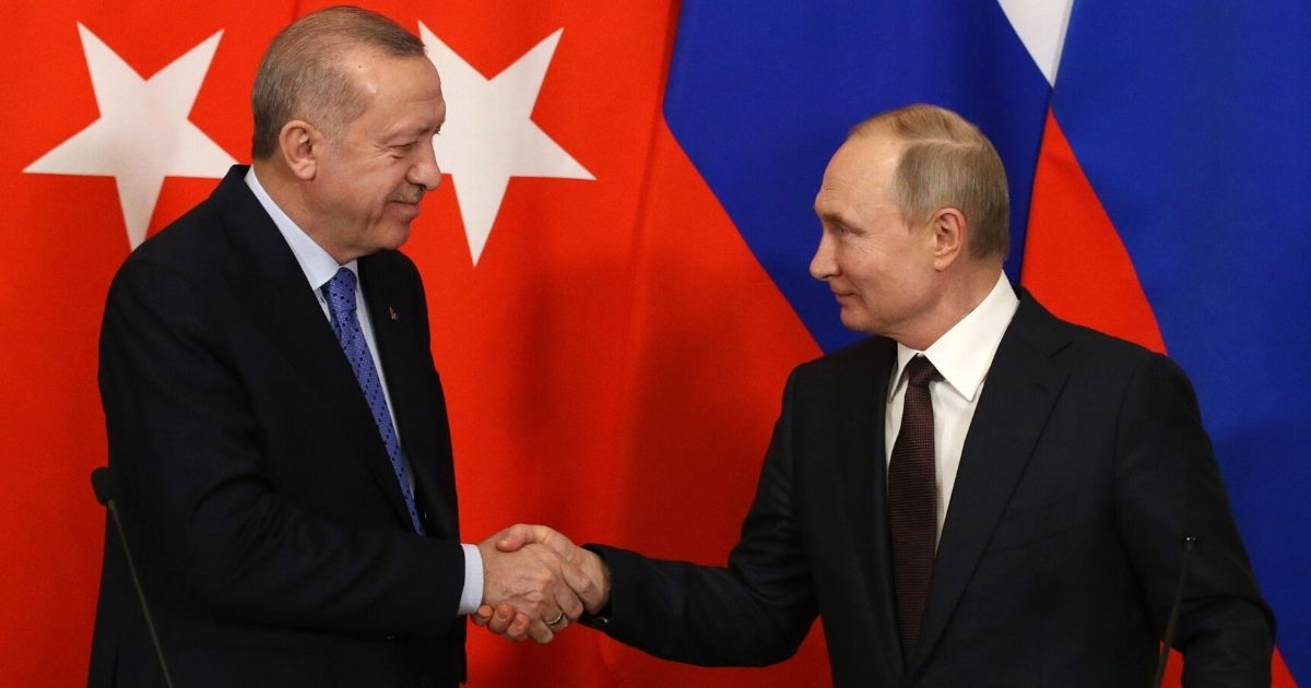 Russian President Vladimir Putin, right, and Turkish President Recep Tayyip Erdogan shake hands during their talks at the Kremlin in Moscow on March 5, 2020.