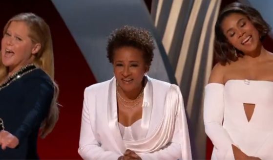 Amy Schumer, left, Wanda Sykes, center, and Regina Hall, right, took a shot at Florida's parental rights bill during Sunday night's Oscars.