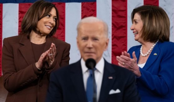Vice President Kamala Harris and House Speaker Nancy Pelosi exchange glances as Joe Biden delivers the State of the Union address to a joint session of Congress Tuesday.