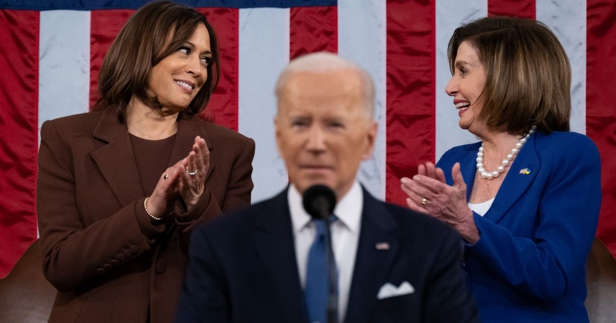 Vice President Kamala Harris and House Speaker Nancy Pelosi exchange glances as Joe Biden delivers the State of the Union address to a joint session of Congress Tuesday.