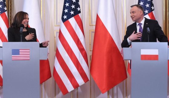 Vice President Kamala Harris laughs during a joint news conference with Polish President Andrzej Duda at Belwelder Palace in Warsaw on Thursday.