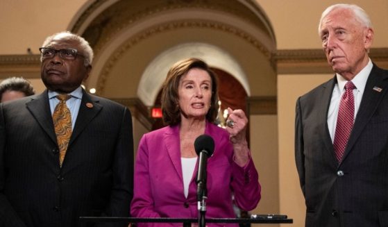 House Democrats, from left, Majority Whip James Clyburn of South Carolina, Speaker Nancy Pelosi of California and Majority Leader Rep. Steny Hoyer of Maryland speak to reporters on their way to the House Chamber at the U.S. Capitol in Washington on Nov. 5.