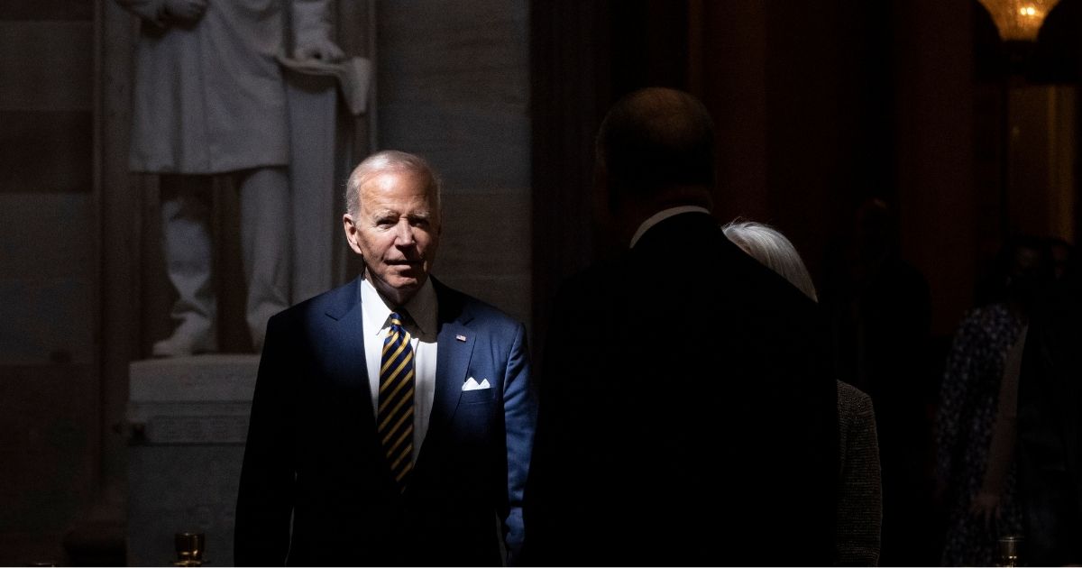 President Joe Biden walks through the U.S. Capitol on Tuesday in Washington, D.C.