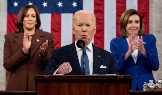 Vice President Kamala Harris, left, and House Speaker Nancy Pelosi applaud as President Joe Biden delivers the State of the Union address during a joint session of Congress at the Capitol in Washington on Tuesday.