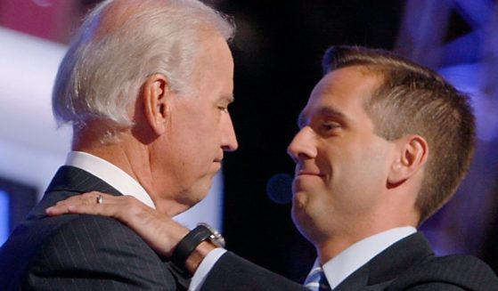 Then-Sen. Joe Biden and his son Beau Biden hug on stage during the Democratic National Convention in Denver, Colorado on Aug. 27, 2008.