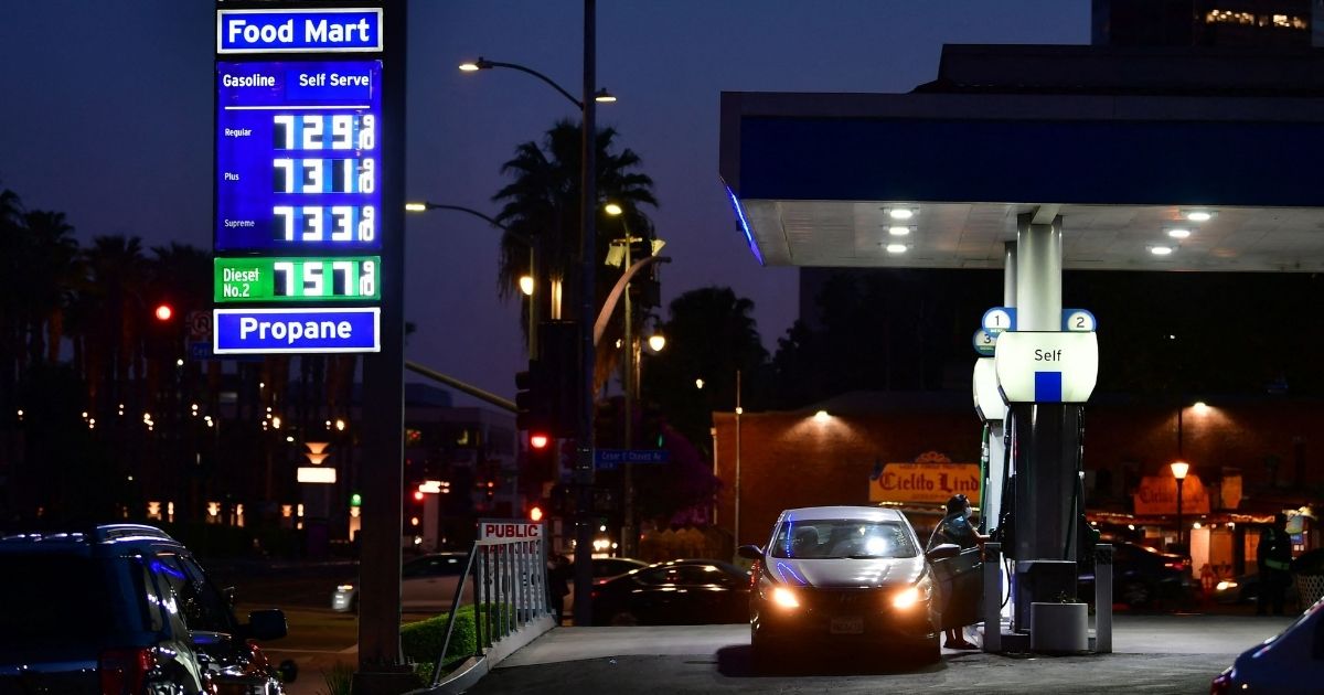 Gas prices of more than $7 per gallon are posted at a downtown Los Angeles gas station on Wednesday.
