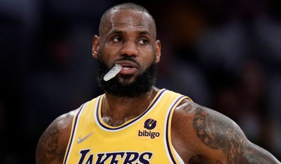 LA Lakers basketball player LeBron James stands on the court in Los Angeles, California, during a game against the Toronto Raptors on March 14.