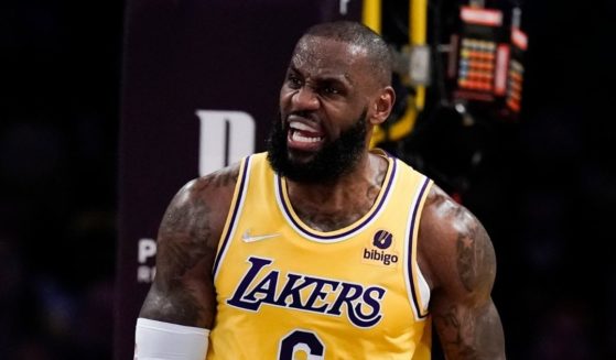 During Monday's NBA game against the Toronto Raptors, Los Angeles Laker's player LeBron James reacts negatively to a foul call against him in the first half.