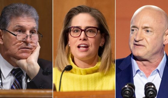 Democratic Sens. Joe Manchin of West Virginia, left, and Krysten Sinema and Mark Kelly of Arizona voted against David Weil, President Joe Biden's choice to head the Labor Department’s Wage and Hour Division.