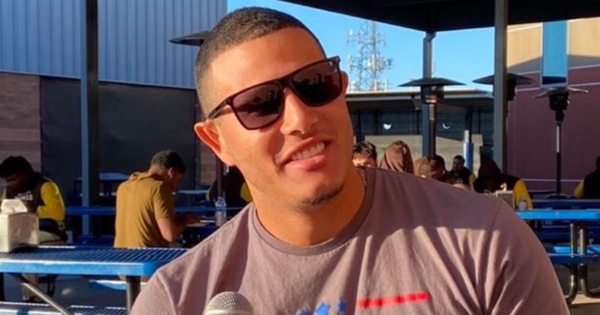 San Diego Padres third baseman Manny Machado wears a "Let's Go Brandon" T-shirt during a spring training interview.