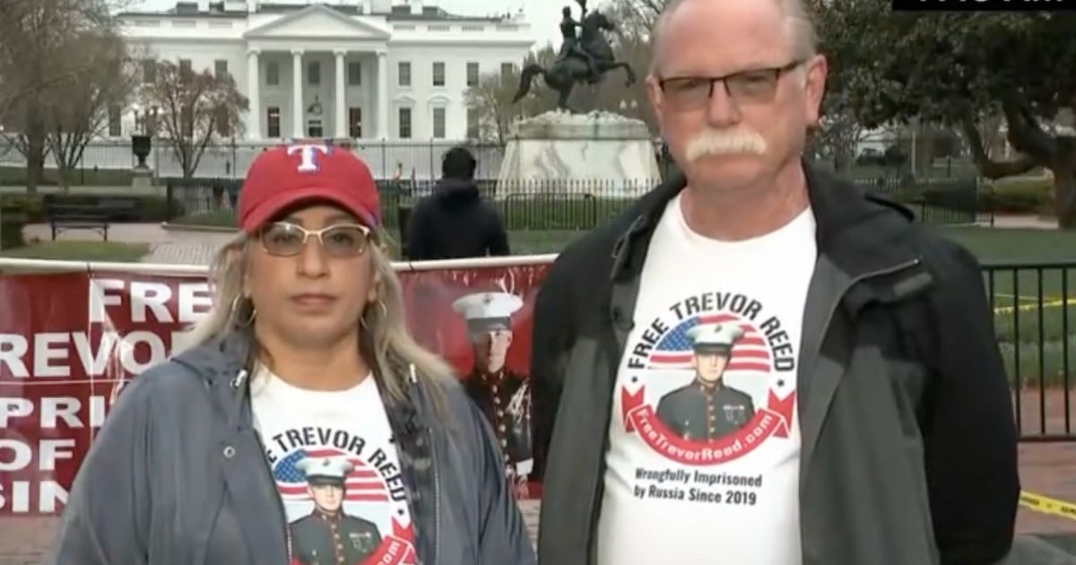 Joey and Paula Reed, parents of imprisoned Marine Trevor Reed, are protesting outside of the White House because President Joe Biden promised to meet with them but has not.