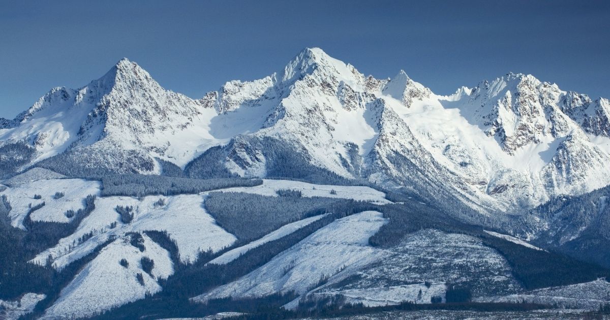 The Twin Sisters Range in Stewart Mountain, North Cascades, Washington, are covered in snow.