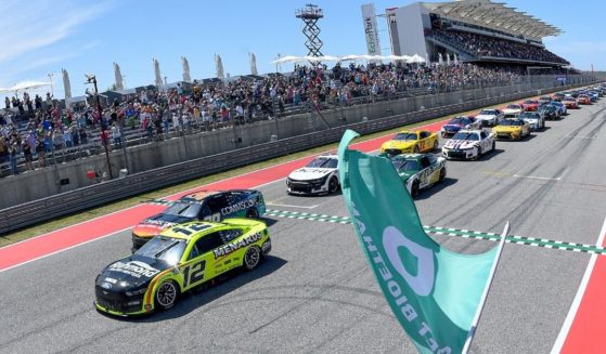 Ryan Blaney, driver of the #12 Menards/Richmond Water Heaters Ford, leads the field to the green flag to start the NASCAR Cup Series Echopark Automotive Grand Prix at Circuit of The Americas on March 27 in Austin, Texas.