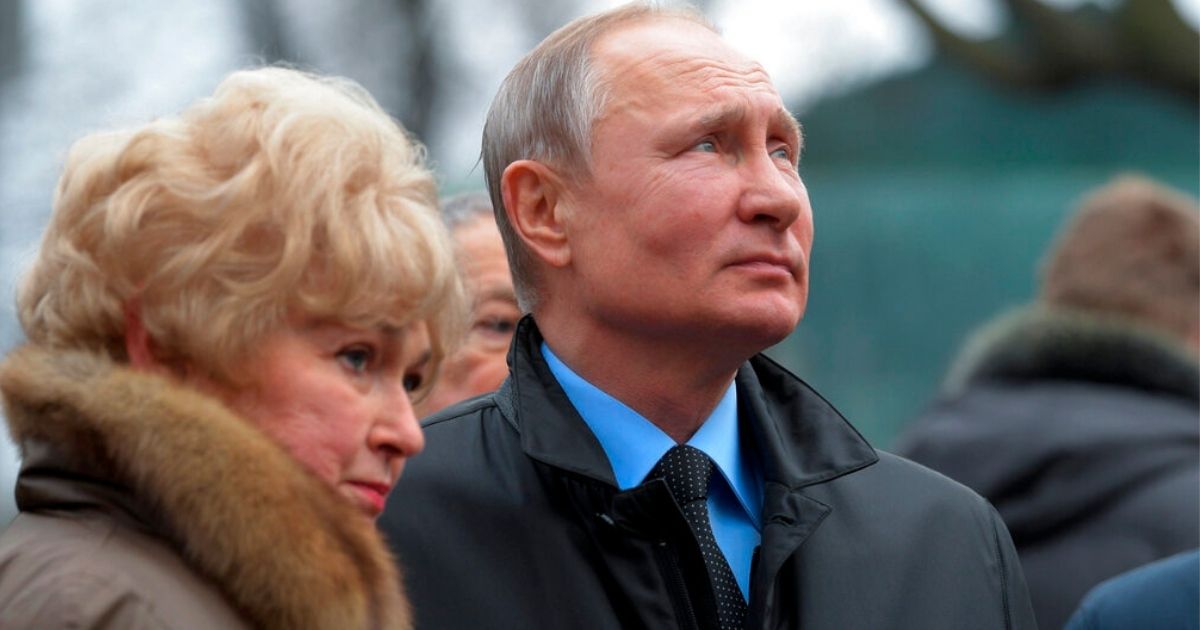 Russian President Vladimir Putin is pictured with Lyudmila Narusova, widow of Putin's political mentor, Anatoly Sobchak, in a file photo from Feb. 2020. Narusova, a member of the Russian parliament, has been one of few Russian officials to speak out openly against the invasion of Ukraine.