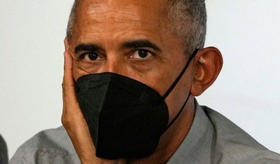 Former President Barack Obama sits at a roundtable meeting at the COP26 U.N. Climate Summit in Glasgow, Scotland, on Nov. 8, 2021.