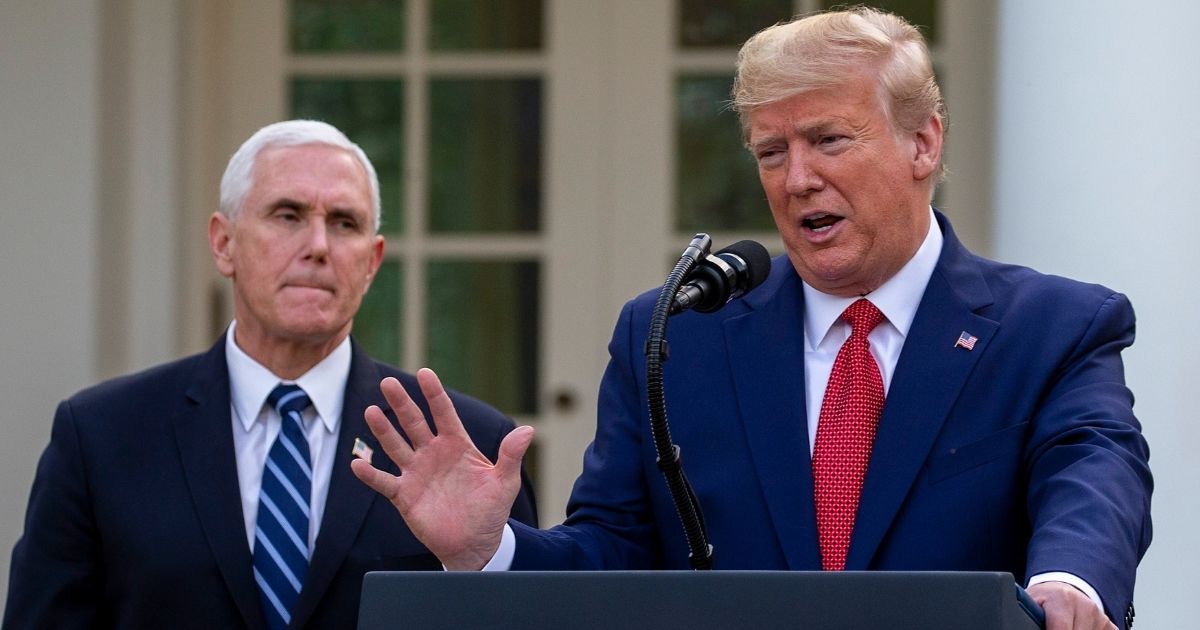 Mike Pence, vice president at the time, listens to then-President Donald Trump speak in the Rose Garden at the White House in Washington on March 29, 2020.