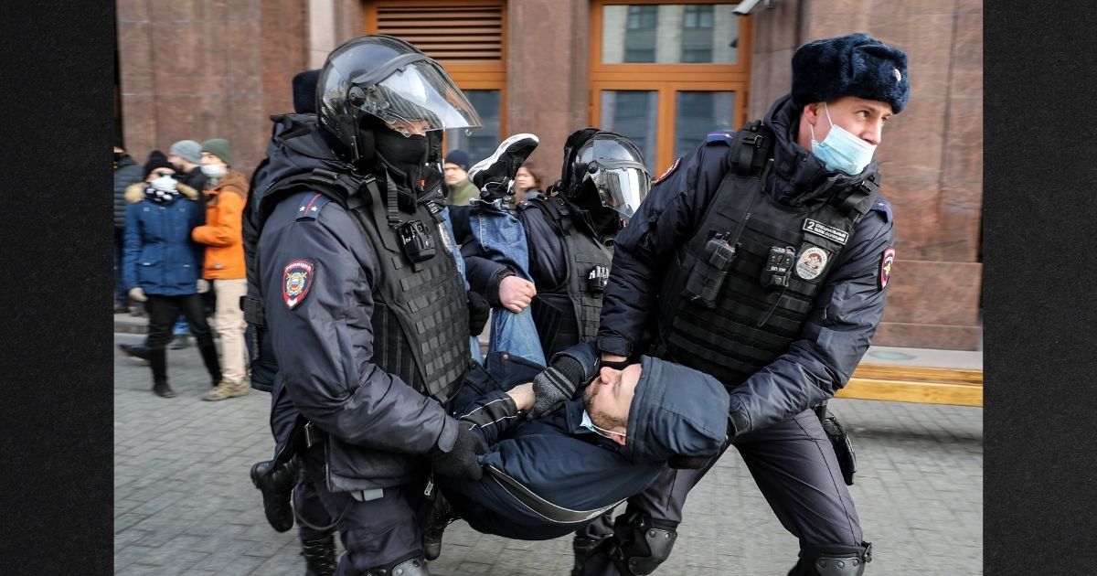 Russian police officers detain a man during an unsanctioned protest rally against the military invasion in Ukraine on March 6 in Moscow. Observers estimate between 100,000 and 200,000 Russians have fled the country, fearing the onset of North Korea-style isolationism.