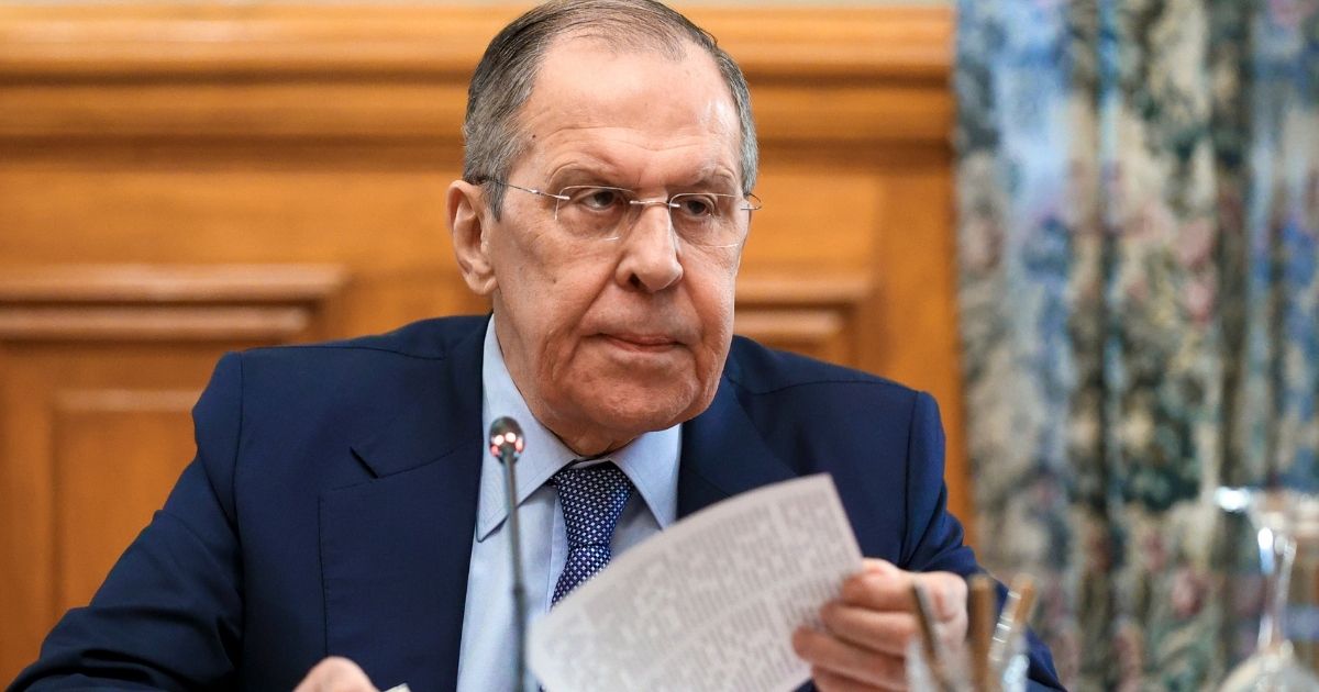 Russian Foreign Minister Sergei Lavrov speaks with Vladislav Deinego of the Luhansk People's Republic and Sergei Peresada of the Donetsk People's Republic in Moscow, Russia, on Friday.