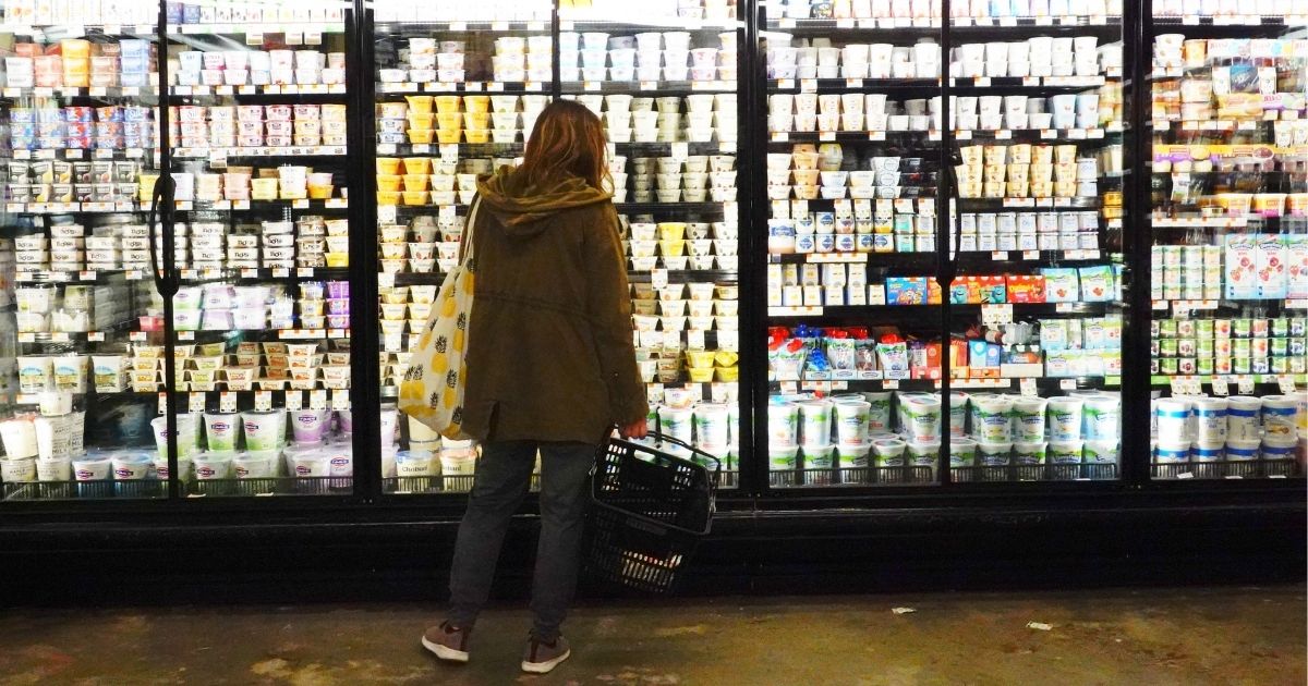 A woman shops for groceries at Lincoln Market in Brooklyn, New York, on Thursday after the Labor Department reported that consumer inflation had risen 7.9 percent over the past year -- the largest spike since 1982.