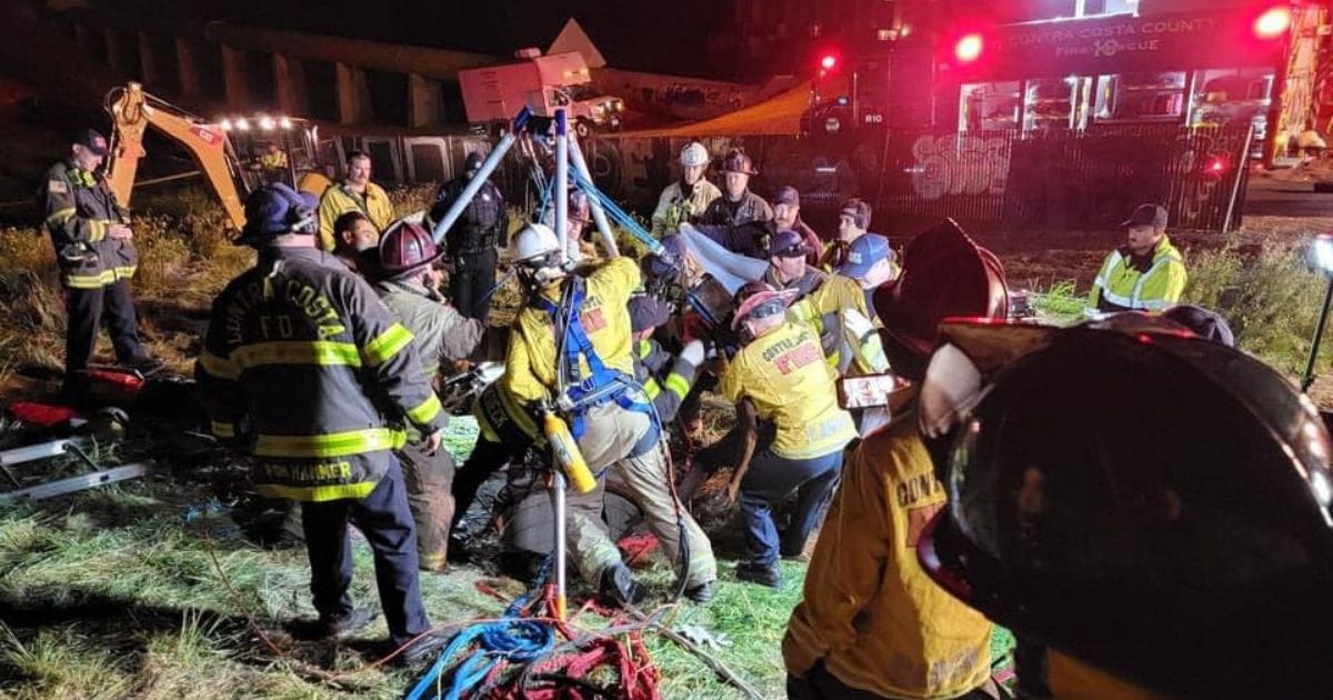 A rescue team works to help a man who got stuck in a storm drain in Antioch, California.