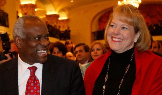 Supreme Court Justice Clarence Thomas and his wife, Virginia Thomas, attend an event in Washington, D.C., where he is introduced at the Federalist Society on Nov. 15, 2007.