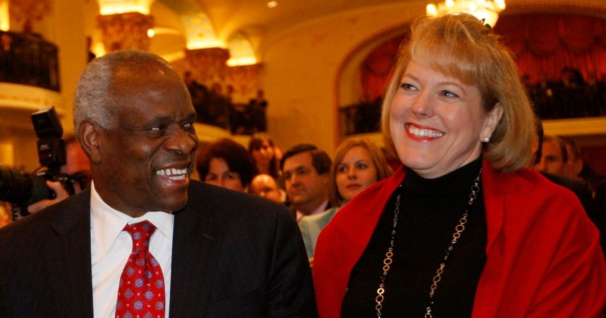Supreme Court Justice Clarence Thomas and his wife, Virginia Thomas, attend an event in Washington, D.C., where he is introduced at the Federalist Society on Nov. 15, 2007.