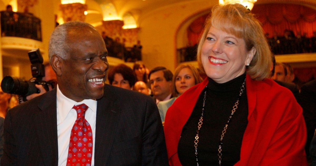 Supreme Court Justice Clarence Thomas shares a laugh with his wife, Virginia "Ginny" Thomas, in Washington on Nov. 15, 2007.