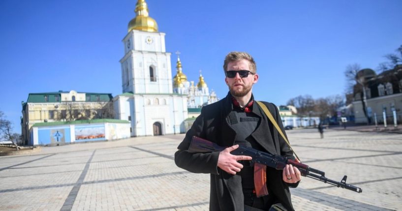A Ukrainian citizen holds a gun on Tuesday in Kyiv, Ukraine.