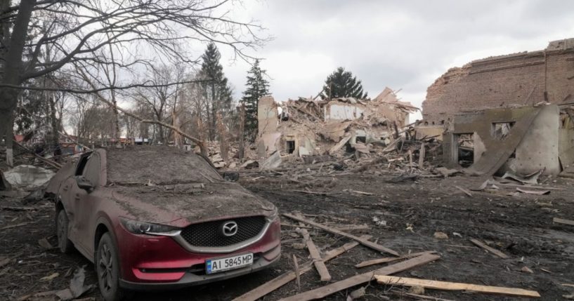 A local house and car are destroyed after air raids were carried out by Russian forces in the village of Byshiv , Ukraine, on Friday.
