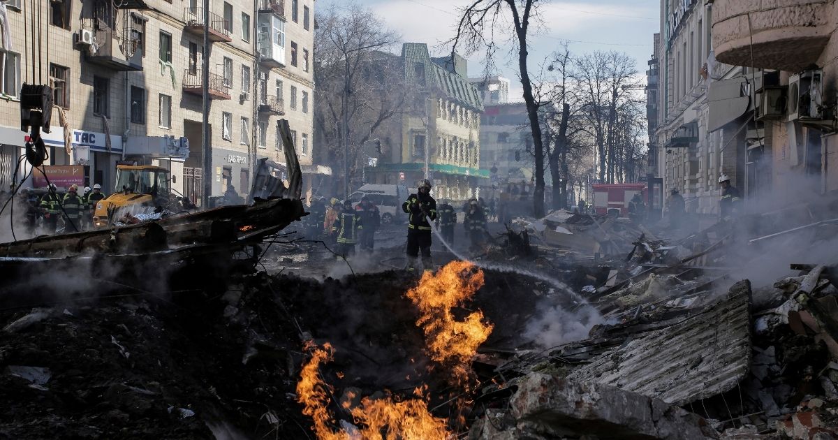 Firefighters in Kharkiv, Ukraine, work to put out a fire in an apartment building after a Russian rocket attack on Monday.