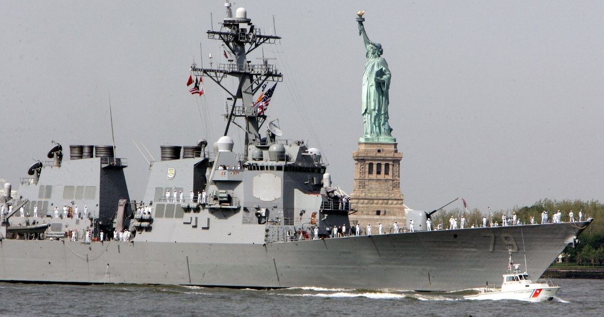 A U.S. Navy guided-missile destroyer is pictured in a 2007 file photo sailing past the Statue of Liberty in New York Harbor.