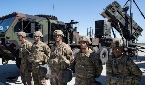 Soldiers in the U.S. 10th Army Air and Missile Defense Command stand next to a Patriot surface-to-air missile battery in a file photo from 2017 exercises in Lithuania.