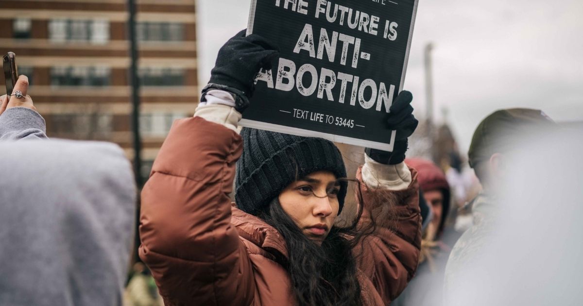 Pro-life demonstrators listen to organizers and activists during a Right to Life rally in Dallas on Jan. 15, 2022.