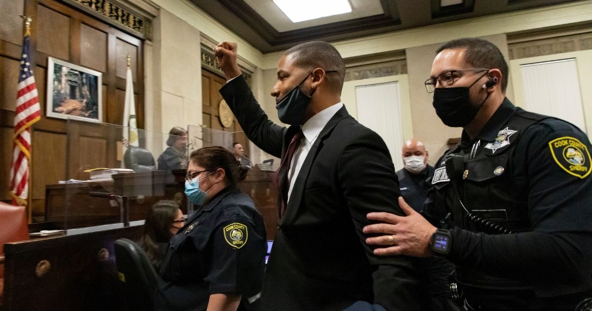 Actor Jussie Smollett is led out of a Chicago courtroom after being sentenced on March 10, 2022.