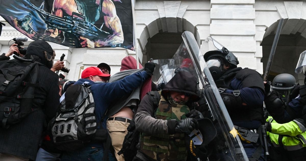 Riot police clash with supporters of then-President Donald Trump during the Jan. 6, 2021 incursion at the United States Capitol.