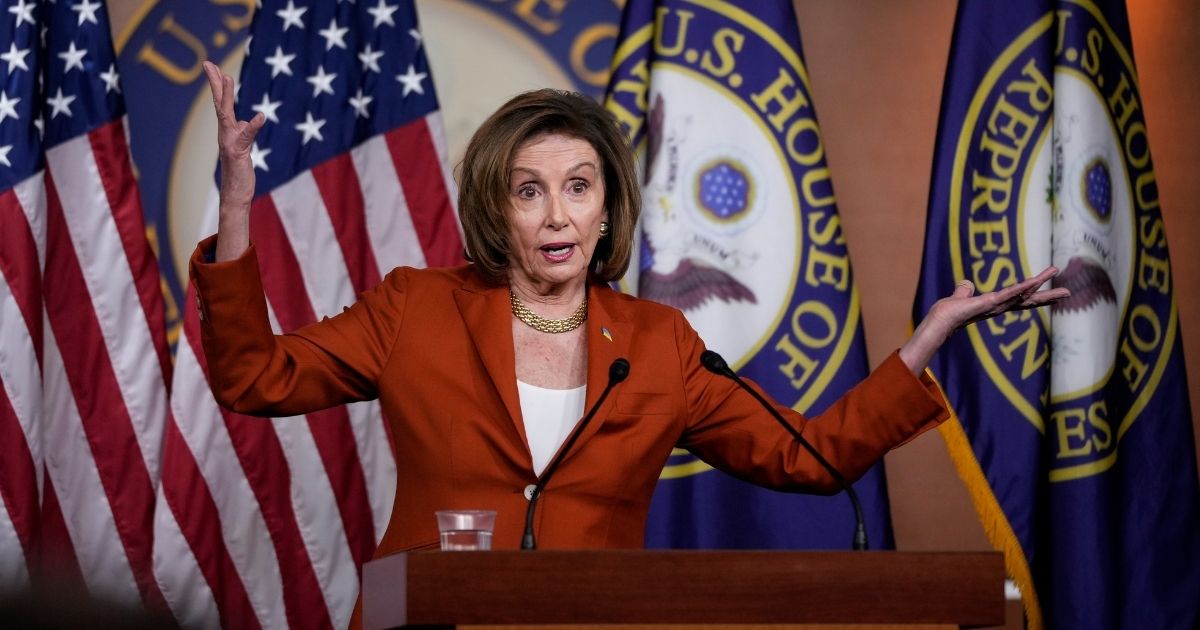 House Speaker Nancy Pelosi gestures wildly during a March 9 news conference at the Capitol.