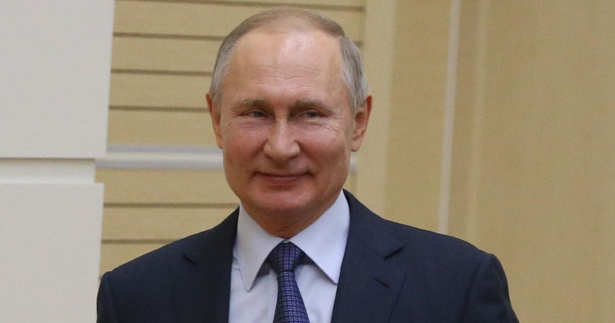 Russian President Vladimir Putin grins in a 2020 file photo.