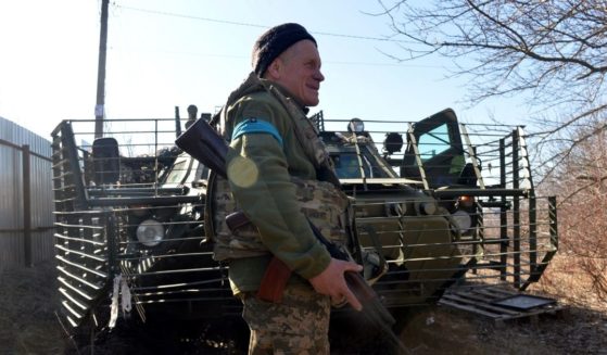 A Ukraine soldier guards a checkpoint Wednesday in Kharkiv, in the eastern part of the country.