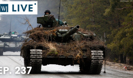Ukrainian tanks move on a road in the Lugansk region on Feb. 26.