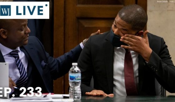 Convicted hate crime hoaxer Jussie Smollett wipes away tears after his grandmother testified at his sentencing hearing in Chicago on Thursday.