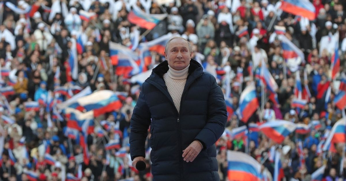 Russian President Vladimir Putin attends a concert in Moscow on March 18.