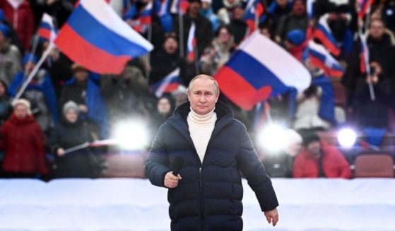 Russian President Vladimir Putin attends a concert in Moscow on March 18.