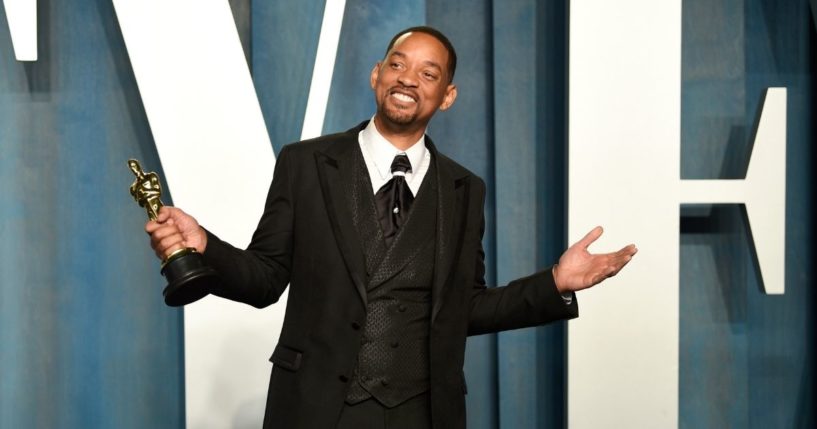 Will Smith posed with his Oscar at the Vanity Fair Oscar Party on Sunday night.