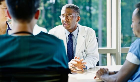 A group of doctors is seen in the above stock image.