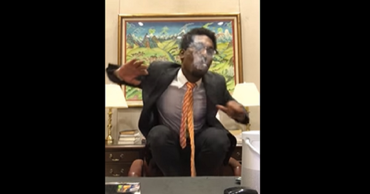 A screen shot of a video Jamarcus Purley, a former aide to California Sen. Dianne Feinstein, made of himself smoking marijuana and grooving to music at the senator's desk after he was fired.