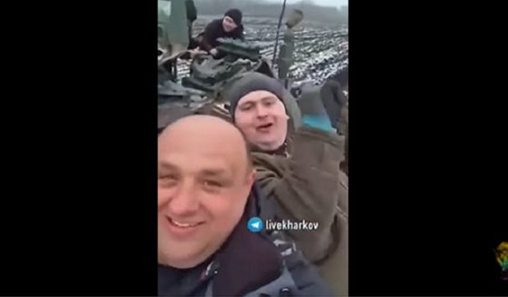Ukrainians celebrate riding a captured Russian armed vehicle in a video last week